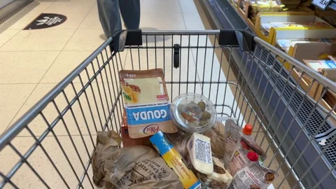 Shopping Cart in Store with Sharp Focus on Cart and Blurred Background Stock Footage 277105365