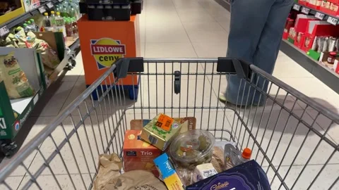 Shopping Cart in Store with Sharp Focus on Cart and Blurred Background Stock Footage 277105383