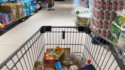 Shopping Cart in Store with Sharp Focus on Cart and Blurred Background Stock Footage 277105396