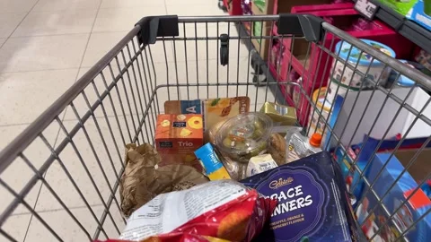 Shopping Cart in Store with Sharp Focus on Cart and Blurred Background Stock Footage 277105401