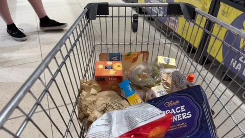 Shopping Cart in Store with Sharp Focus on Cart and Blurred Background Stock Footage 277105405