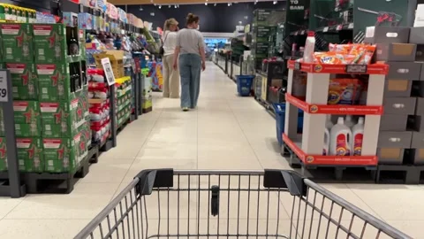 Shopping Cart in Store with Sharp Focus on Cart and Blurred Background Stock Footage 277105441