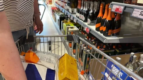 Shopping Cart in Store with Sharp Focus on Cart and Blurred Background Stock Footage 277105448