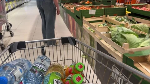 Shopping Cart in Store with Sharp Focus on Cart and Blurred Background Stock Footage 277105520