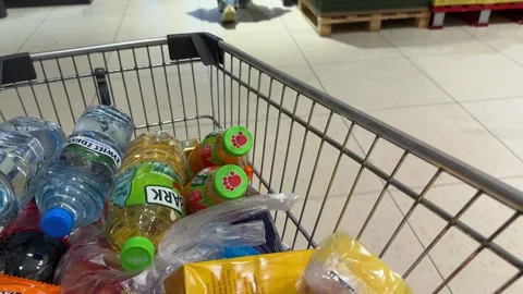 Shopping Cart in Store with Sharp Focus on Cart and Blurred Background Stock Footage 277105538