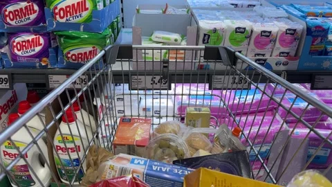 Shopping Cart in Store with Sharp Focus on Cart and Blurred Background Stock Footage 277135956