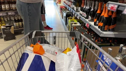 Shopping Cart in Store with Sharp Focus on Cart and Blurred Background Stock Footage 277135971