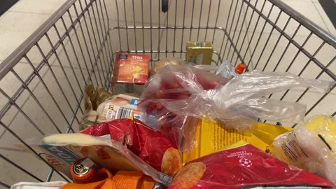 Shopping Cart in Store with Sharp Focus on Cart and Blurred Background Stock Footage 277135979