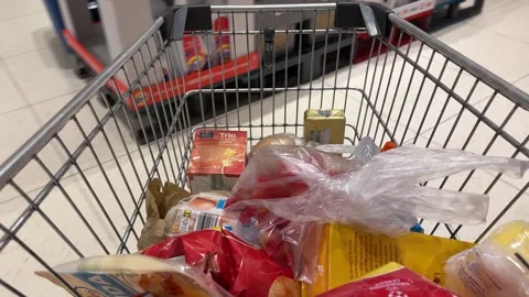 Shopping Cart in Store with Sharp Focus on Cart and Blurred Background Stock Footage 277135986