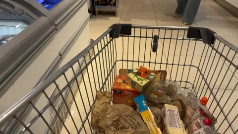 Shopping Cart in Store with Sharp Focus on Cart and Blurred Background Stock Footage 277135992