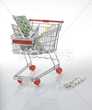 Shopping cart with tablets packed in blister Stock Photos