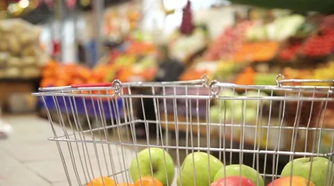 Shopping cart with vegetables on the background of the market Stock Footage 59336071