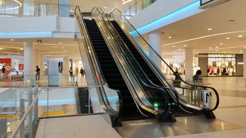 Shopping center interior with functional escalators Video stock 304059922