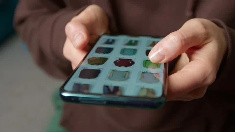 Shopping for clothes in online stores using a mobile phone.  Stock Footage 230532155