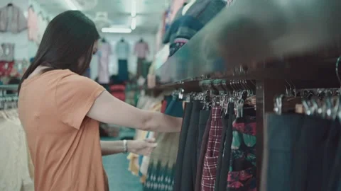 Shopping for Clothes in a Retail Store Stock Footage 315929180