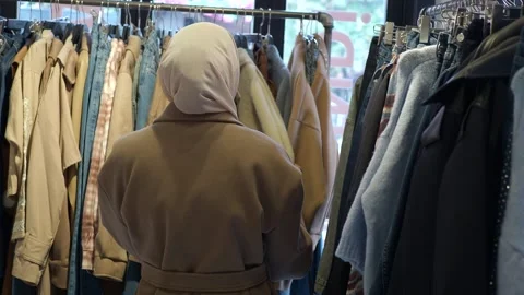 Shopping for clothes in a store with many options Stock Footage 336039047