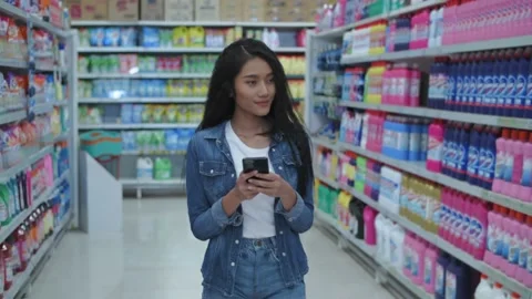 Shopping concepts of 4k Resolution. Young women use mobile phones to search f Stock Footage 149010619