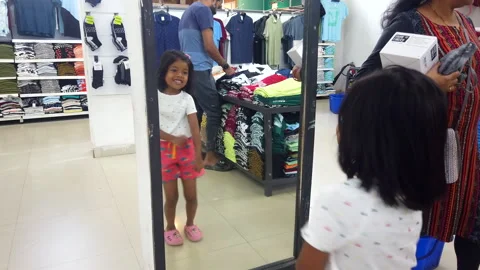 Shopping Day kid dancing in front of mirror Stock Footage 267033898