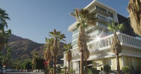 Shopping district in Palm Springs with mountain backdrop on sunny summer day Stock Footage 204166310