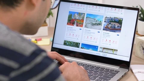 Shopping For a House Online on Computer Laptop Real Estate Site Stock Footage