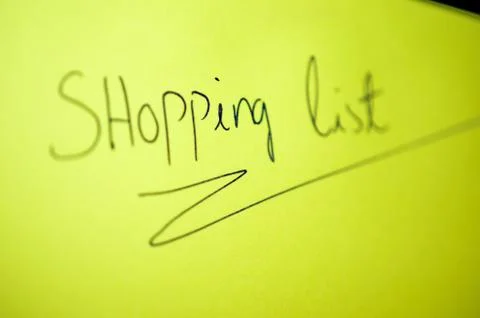 Shopping list on yellow notepad Foto stock