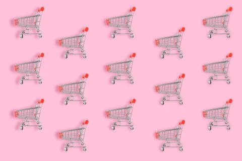 Shopping lover concept. Seamless pattern shopping cart on pink background. Fl Stock Photos