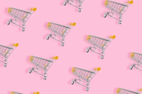 Shopping lover concept. Seamless pattern shopping cart on pink background. Fl Stock Photos