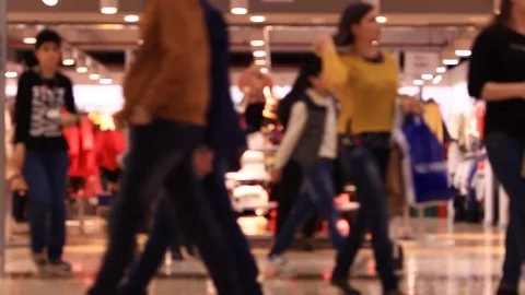 Shopping in mall, walking people, blurred background. Time lapse. Stock Footage