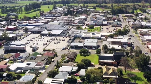 Shopping malls, centres and district in remote Bega town – aerial flying as 4k Stock Footage 196807201