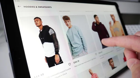 Shopping Online For Cloths on a Tablet Computer Screen Stock Footage 129317031