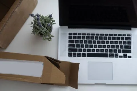 Shopping online e-comerce, Parcel boxes on a laptop. Stock Photos