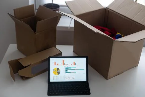 Shopping online e-comerce, Parcel boxes on a laptop. Stock Photos