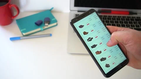 Shopping Online Using Smartphone App And Choosing Shoes. Stock Footage 145333384
