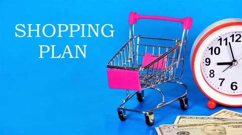 Shopping plan. Text label on the background of a shopping cart and cash. Stock Photos