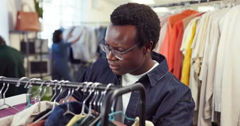 Shopping, rack or customer in store with clothing, outfit search or decision Stock Footage 345630077