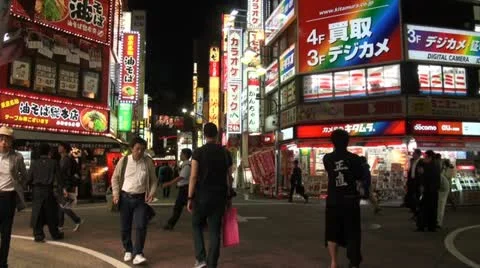Shopping restaurant district neon lights Shinjuku nightlife Tokyo Japan Stock Footage
