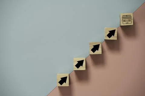 Shopping store and up arrow print screen on wooden block cube on white Stock Photos