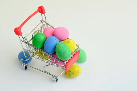 Shopping trolley with Easter eggs Stock Photos