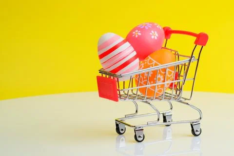 Shopping trolley with Easter eggs Stock Photos