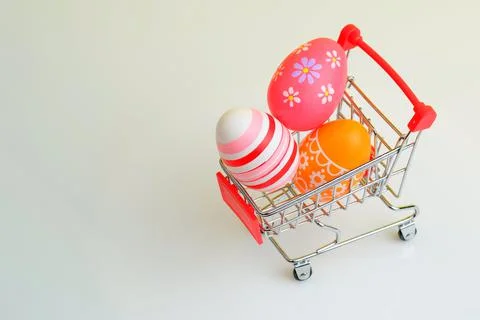 Shopping trolley with Easter eggs Stock Photos