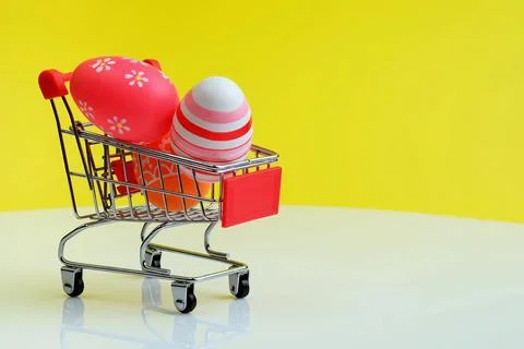 Shopping trolley with Easter eggs Stock Photos
