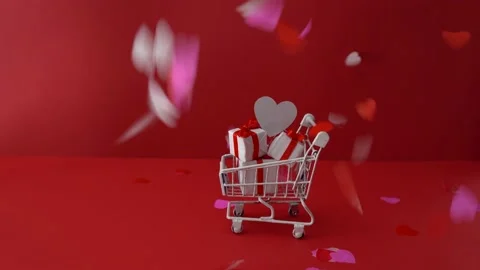 Shopping trolley with gift boxes on red. St. Valentine's Day shopping and sale Stock Footage 167934137