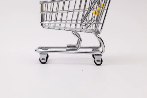 Shopping trolley on the white desk 库存照片