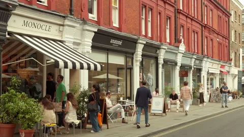 Shops and cafes on Chiltern Street in Marylebone, London, UK Stock Footage 290811684