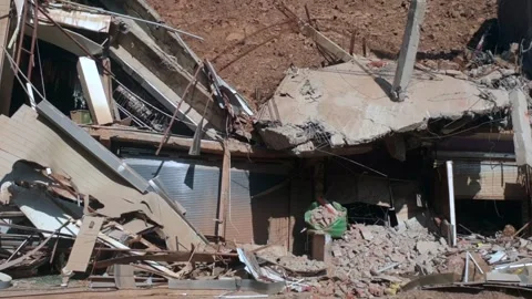 Shops and hotel damaged due to landslide Stock-Footage 322929666