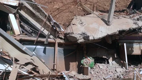 Shops and hotel damaged due to landslide Stock Footage 322929902
