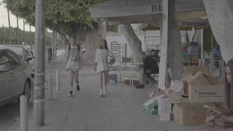 Shops and people along the roadside in Paphos, Cyprus Stock Footage 344056598