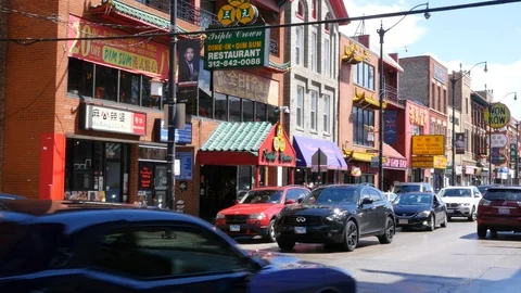 Shops and traffic in Chicago's Chinatown Stock Footage