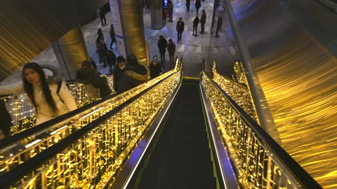 The Shops is decorated with millions of Christmas lights in Hudson Yards in NYC Stock Footage 230055893