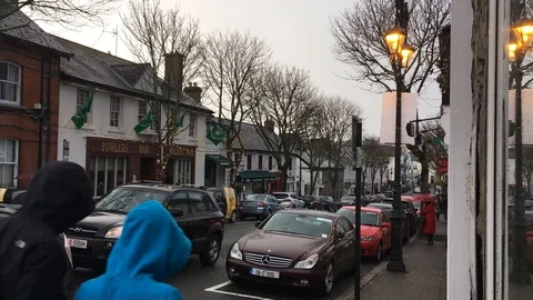 Shops, Pubs, and Traffic in Small Town Ireland, Malahide Stock Footage 88461764